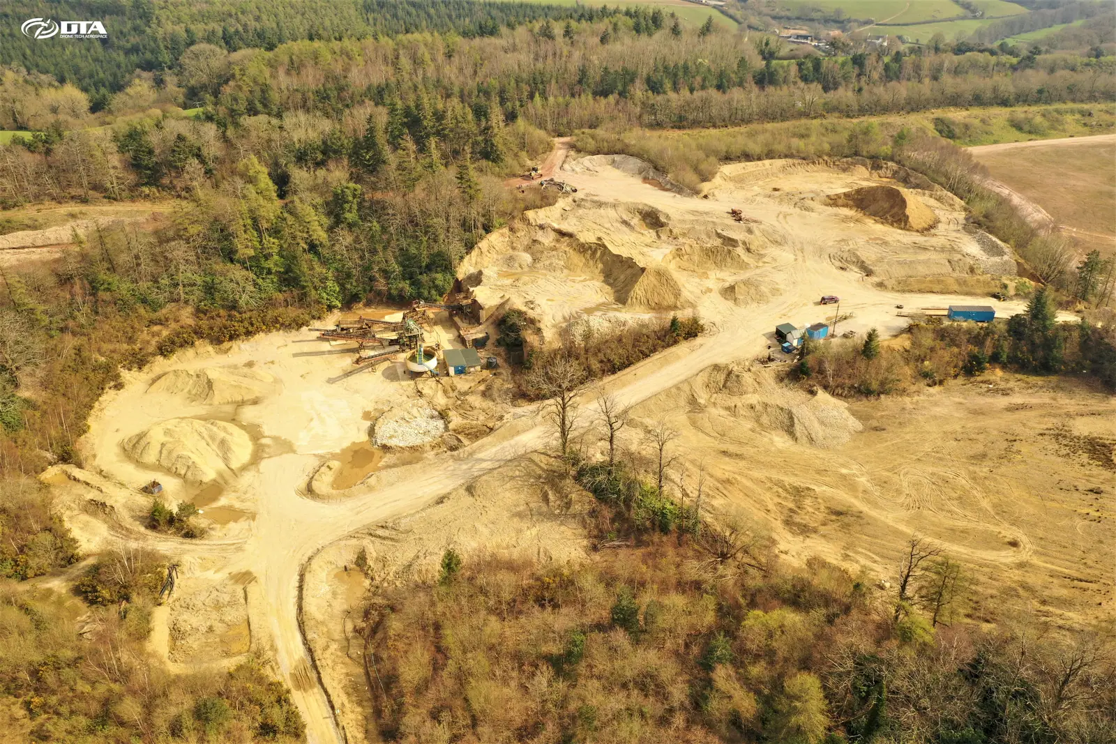 Aerial drone topographical survey of a working quarry in Devon, showing benches, haul roads and stockpiles