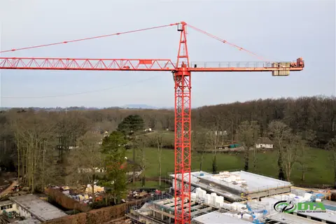 Cranes and scaffolding on a construction site from the air