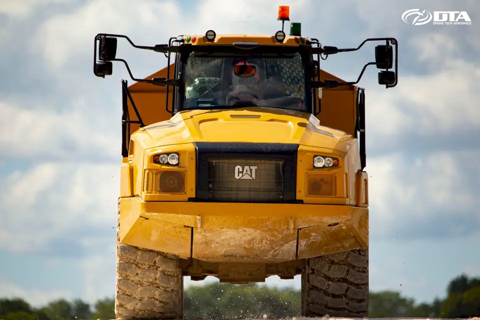 CAT heavy hauler working in a quarry captured from the air